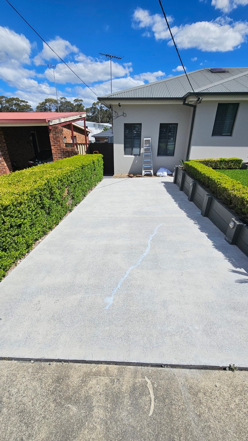 Quartz broadcast applied to second driveway during installation