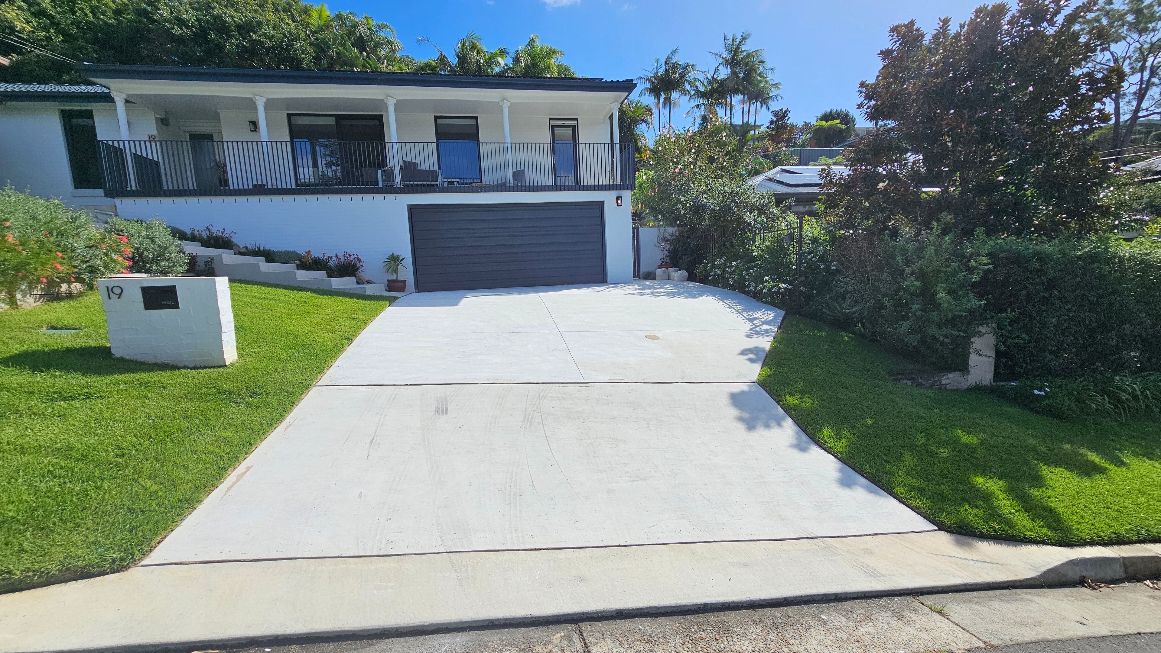 Residential driveway after concrete grinding — clean finish