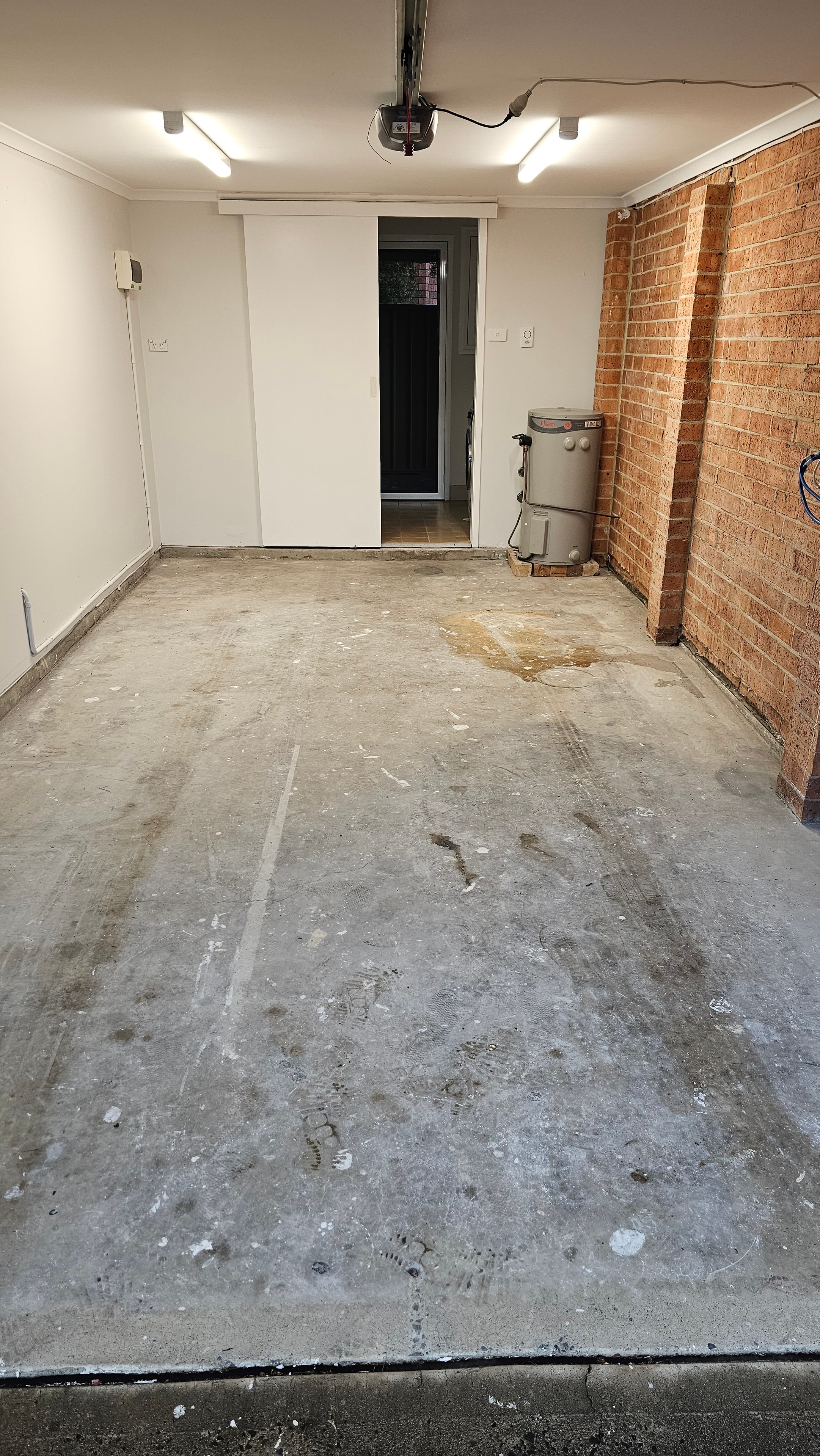 Industrial space with exposed brick ceiling before grinding