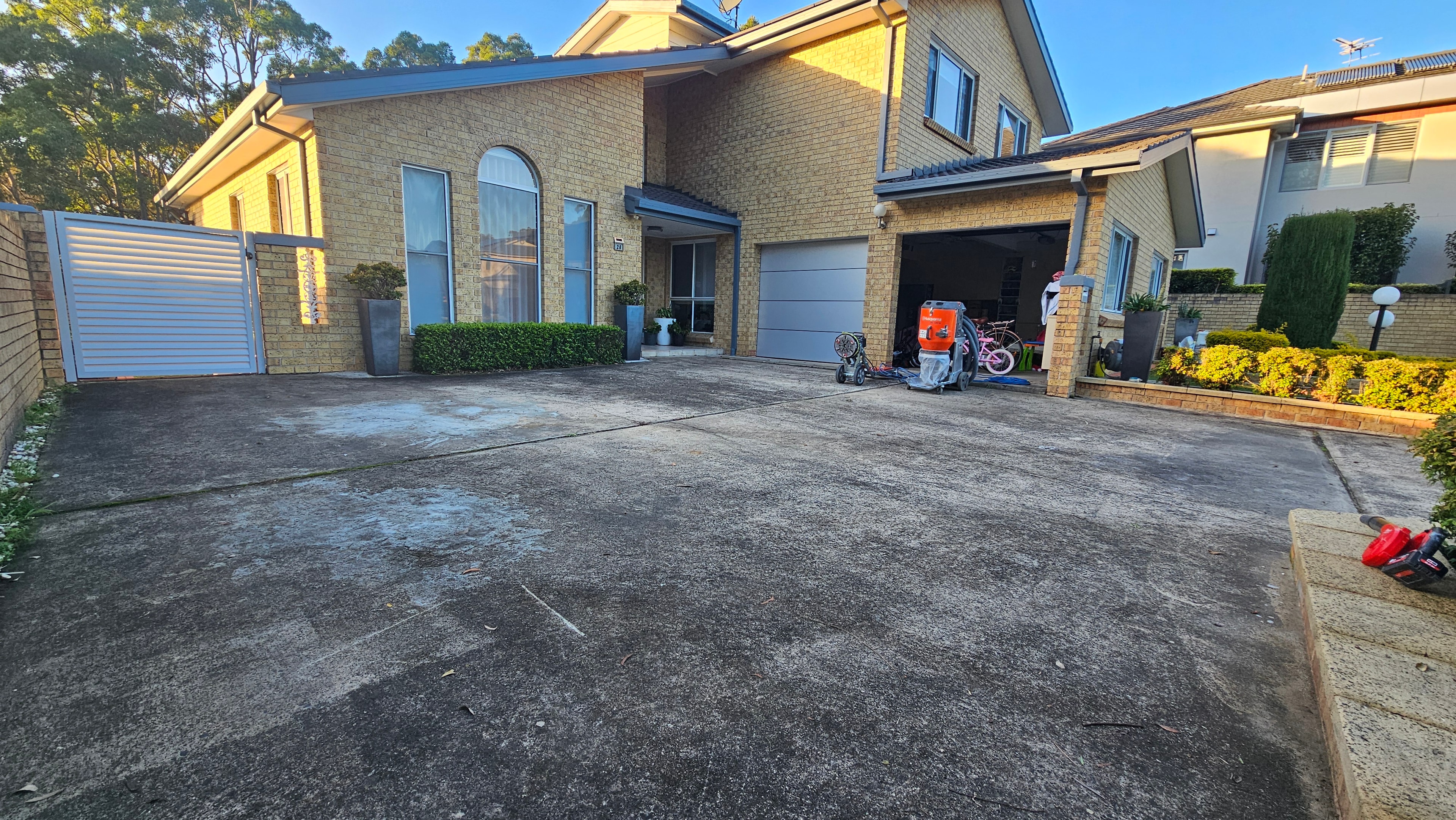 Large residential driveway before concrete grinding
