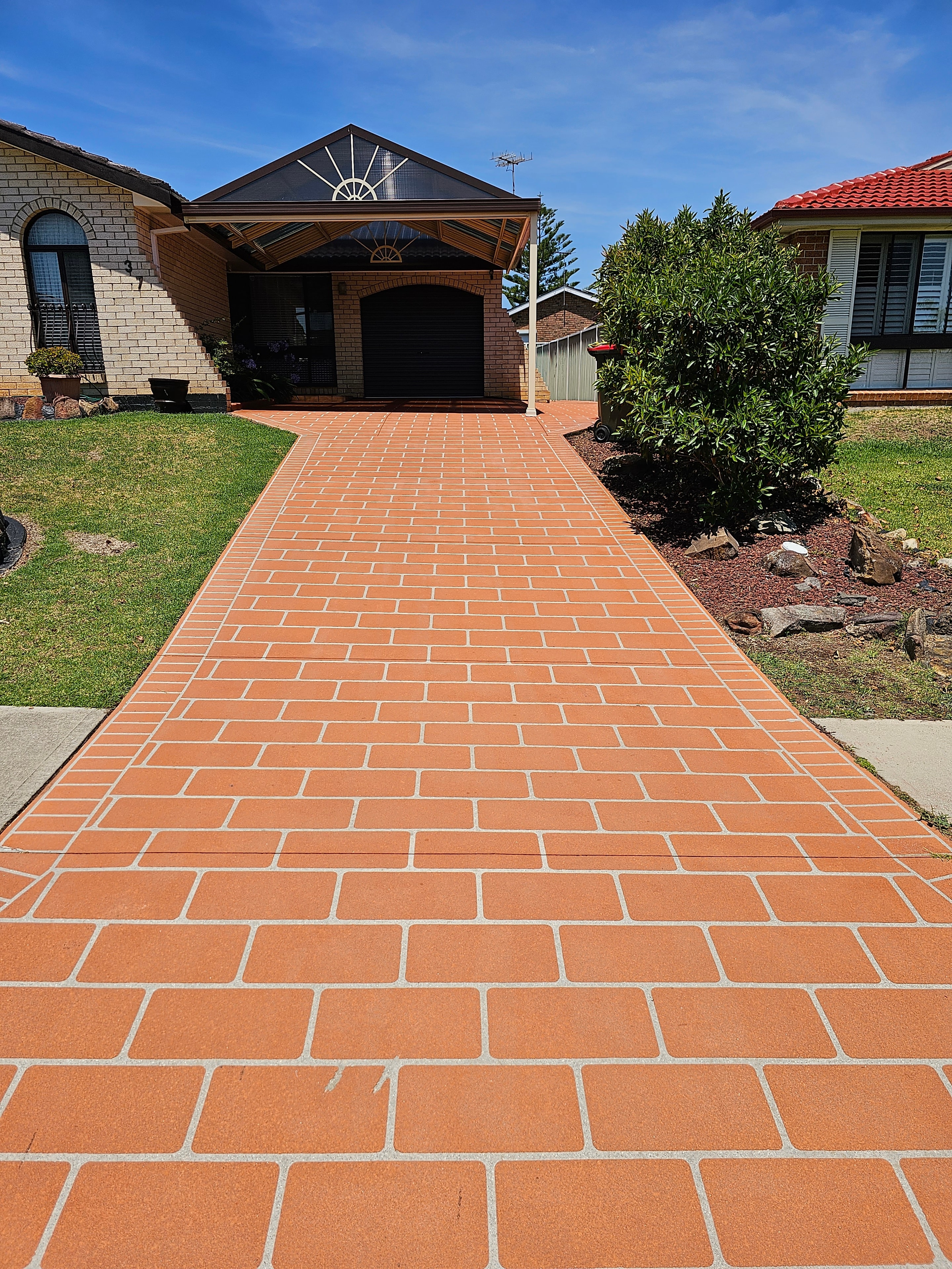 Brick paver driveway after high pressure cleaning — bright clean finish